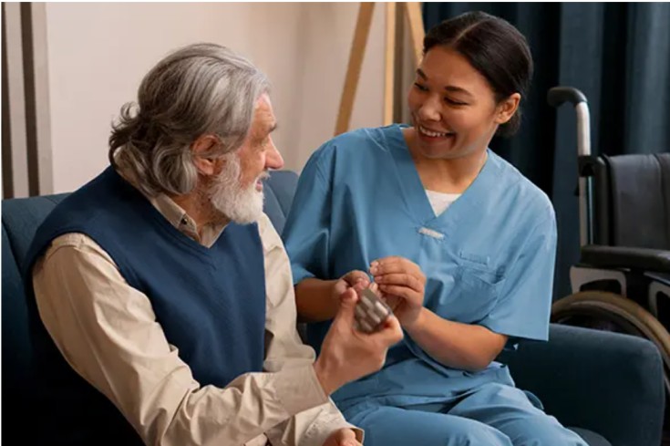 an elder care professional taking care of an old man